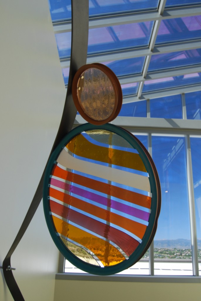 Kaiser Skylight Atrium Stairwell, detail image of two stained glass bike wheels
